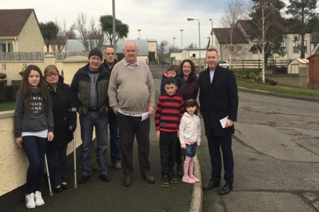 Minister Hazzard with residents of Loughview Cottages, Loughinisland